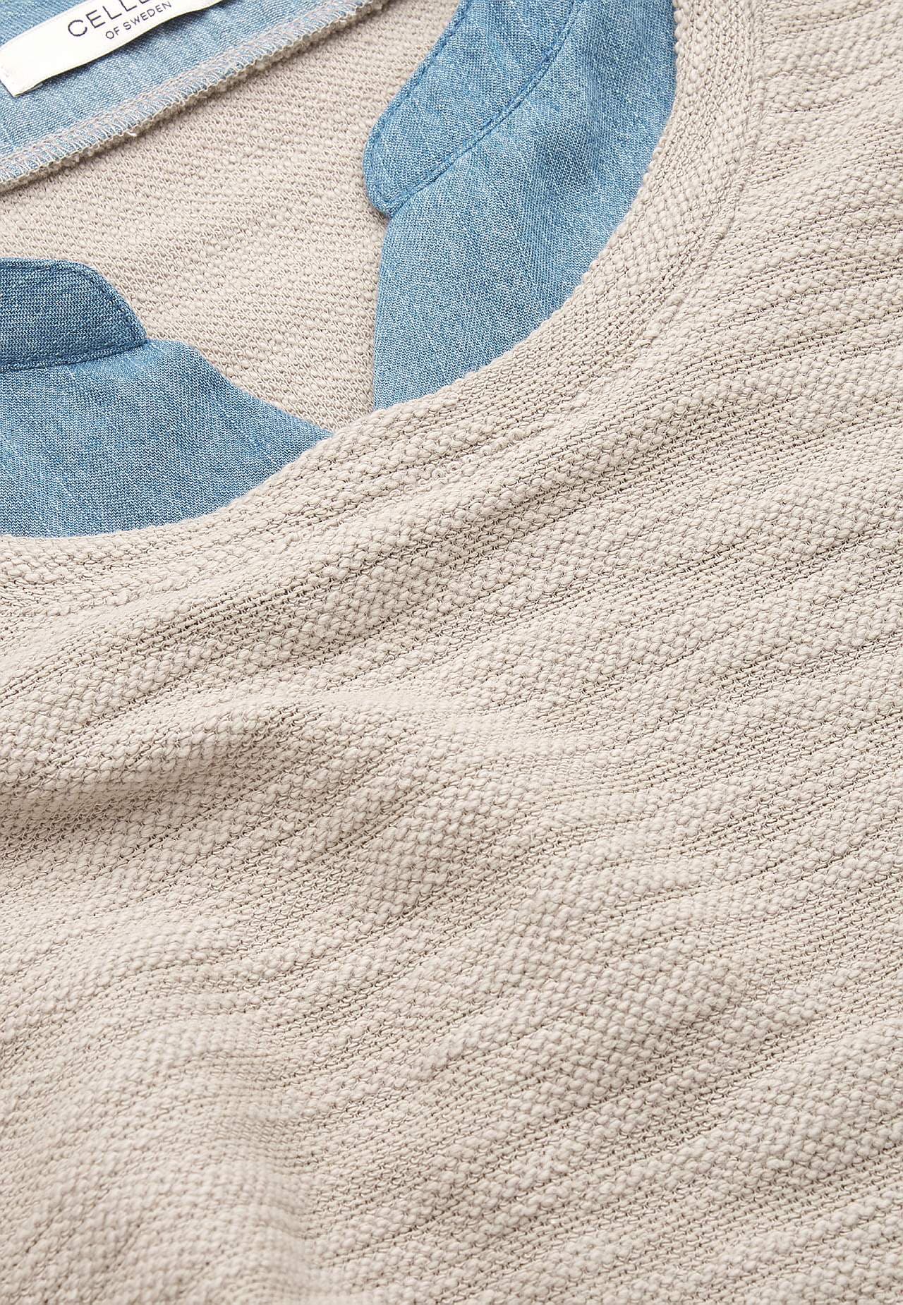 Džersija tops ar džinsauduma detaļām