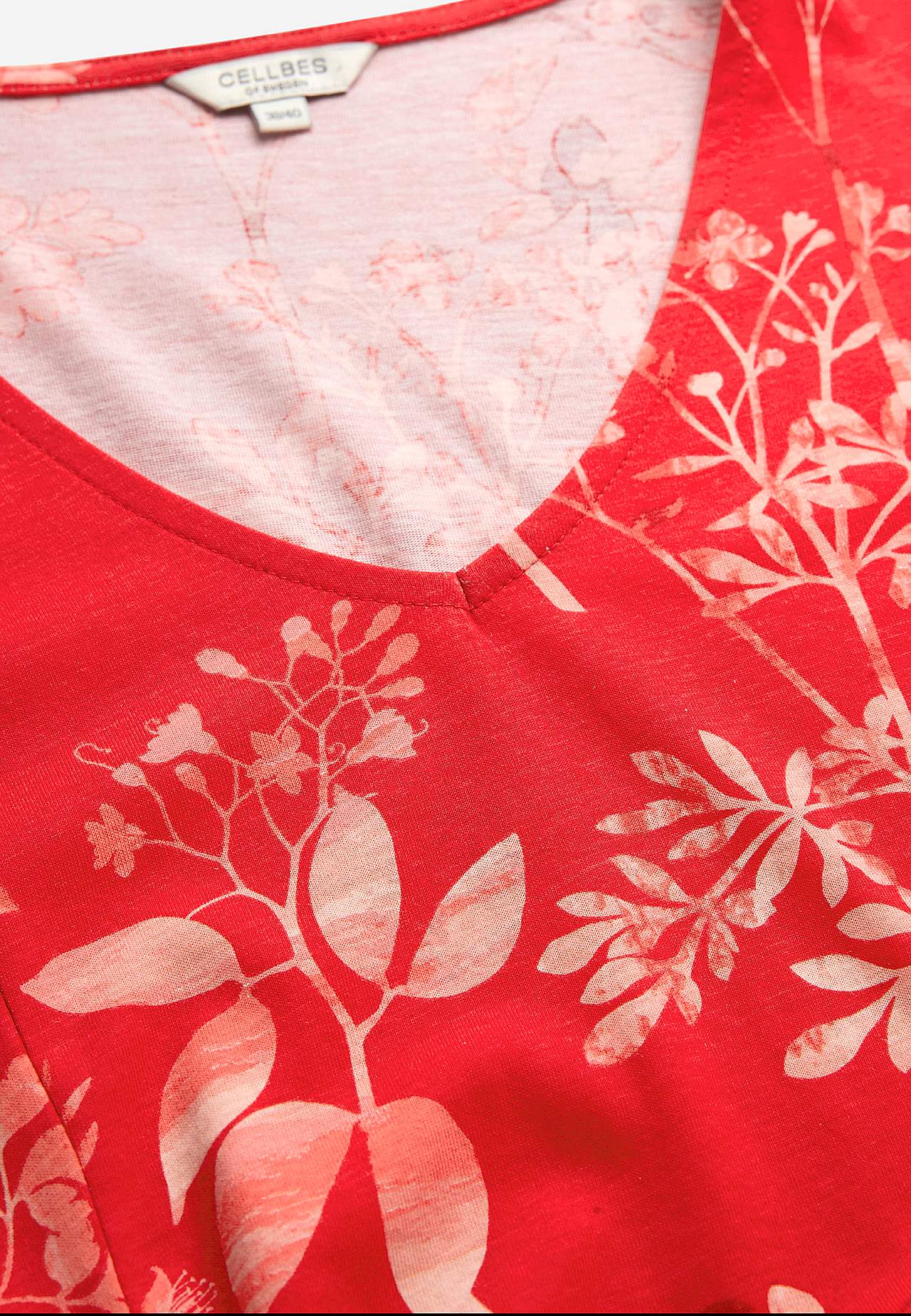 Rakstaina trikotāžas kleita ar kabatām